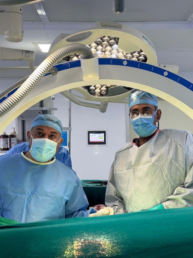 Dr. Shahrookh Vatchha with another surgeon during a surgery