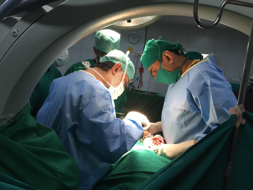 Dr. Shahrookh Vatchha while performing an orthopedic surgery
