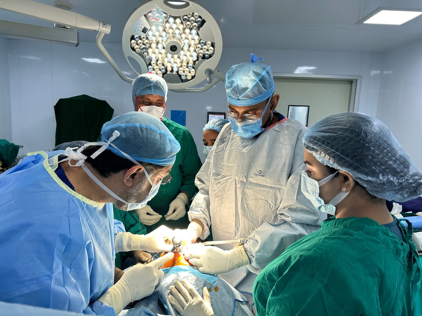 Dr. Shahrookh Vatchha while performing a surgery